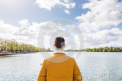 A Chinese tourist standing in front of the Maschsee Lake of Hannover, Germany Editorial Stock Photo