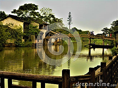 Chinese traditional atmosphere and mood, lake, boat and bridge Stock Photo