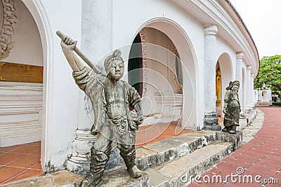 The Chinese Warrior Stone Statues stand near the door in Thai temple, focus selective Editorial Stock Photo