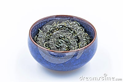 Chinese Wild Green tea. Ye Sheng Lu Cha in a blue ceramic bowl Stock Photo