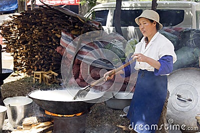 Chinese Woman Cooking Rice Editorial Stock Photo