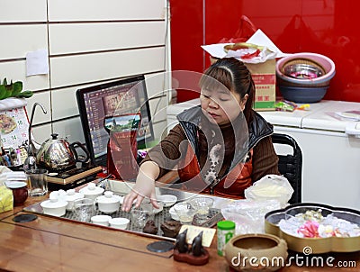 Chinese woman performing the tea ceremony Editorial Stock Photo