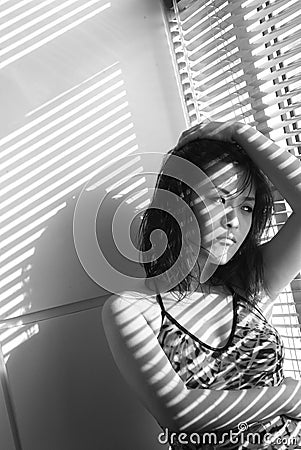 Chinese woman at window Stock Photo