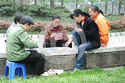 Chinese women playing cards Editorial Stock Photo