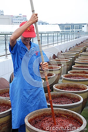 Chinese worker making Pixian Horsebean Chili Paste Editorial Stock Photo