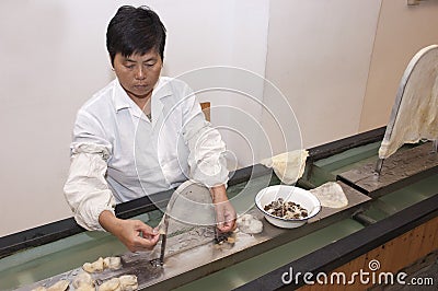 Chinese Worker at Suzhou, China, Silk Factory Editorial Stock Photo