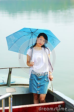 Chinese young girl on boat Stock Photo