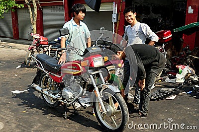Pixian Old Town, China: Youths with Motorcycle Editorial Stock Photo