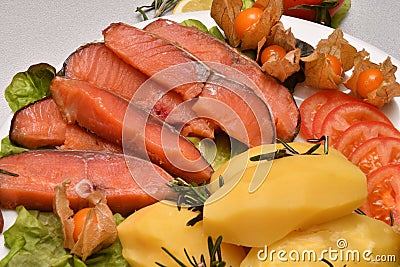 Chinook salmon cold smoking with cooked potatoes Stock Photo