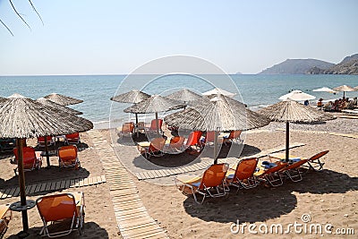 Chios Island, beach with sunbeds in Greece Stock Photo