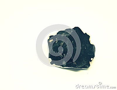 Chipped obsidian stone with cavity inside, sharp cracks flint Stock Photo