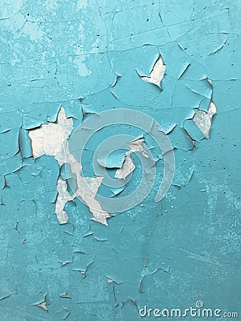 CHIPPED PAINT: Aqua paint on an old door has started to crack and peal Stock Photo