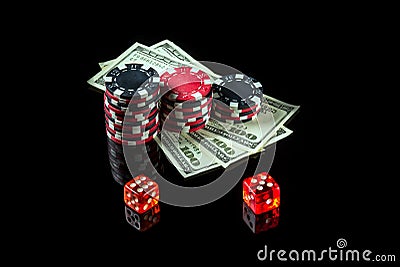 Chips with dollars and dice on a black background. Winning after the maximum combination of twelve Stock Photo