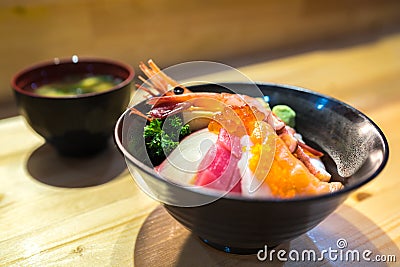 Chirashi sushi, Japanese food, rice bowl with raw salmon sashimi, scallop, shrimp, surf clam, salmon eggs, octopus, tuna Stock Photo