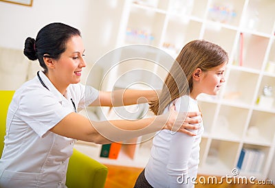 Chiropractor doing adjustment on female patient Stock Photo