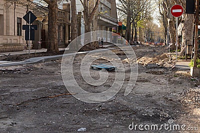 CHISINAU, MOLDOVA - CIRCA APR 2023: Road repair, the center of the city, empty street. Damaged street surface, repair process Editorial Stock Photo