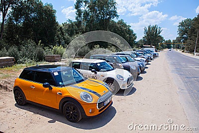 Chisinau, Moldova. July 14, 2016 : Mini Cooper club festival in Moldova. Orange MINI Cooper in dark forest on July 14, 2016 in Chi Editorial Stock Photo