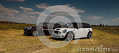 Chisinau, Moldova. July 14, 2016 : Mini Cooper club festival in Moldova. Orange MINI Cooper in dark forest on July 14, 2016 in Chi Editorial Stock Photo