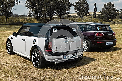 Chisinau, Moldova. July 14, 2016 : Mini Cooper club festival in Moldova. Orange MINI Cooper in dark forest on July 14, 2016 in Chi Editorial Stock Photo