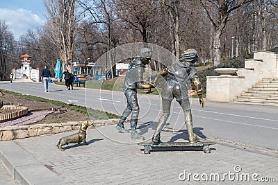 Sculpture of skateboarders with Basset Hound dog sculpture by Petru Glavan Editorial Stock Photo