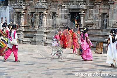 Women pilgrims wear red sarees in the Shiva Nataraja temple Editorial Stock Photo