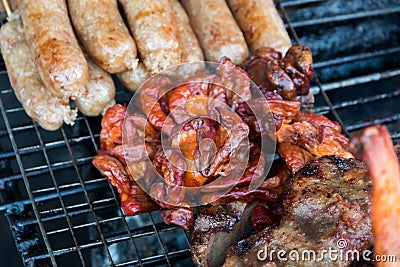 Chitterlings on grill, Thailand Stock Photo