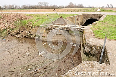 Chiusa ditch river agriculture water transfer panorama landscape agricultural work Italy Italian Stock Photo