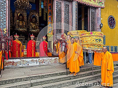 Buddhist monks conducting rite at Ancient Sutra Worship Platform on Tiantai Peak of Mount Jiuhua (Jiuhuashan) Editorial Stock Photo