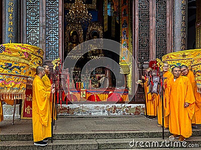 Buddhist monks conducting rite at Ancient Sutra Worship Platform on Tiantai Peak of Mount Jiuhua (Jiuhuashan) Editorial Stock Photo