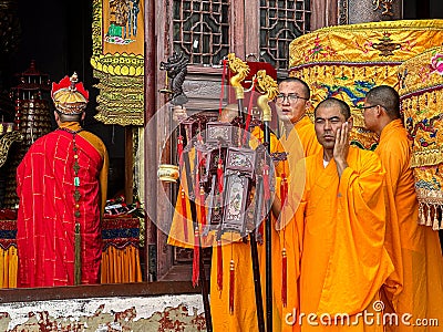 Buddhist monks conducting rite at Ancient Sutra Worship Platform on Tiantai Peak of Mount Jiuhua (Jiuhuashan) Editorial Stock Photo