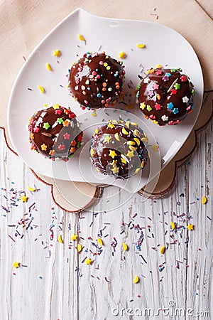Chocolate apples with sprinkles candy. vertical top view Stock Photo