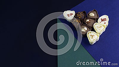 chocolate assortment candies isolated on geometric box Stock Photo