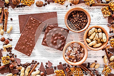 Chocolate bars of different varietes on grey wooden background top view Stock Photo