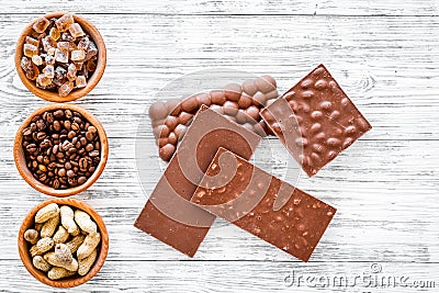 Chocolate bars of different varietes on grey wooden background top view Stock Photo