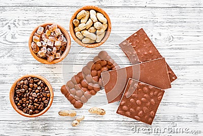 Chocolate bars of different varietes on grey wooden background top view Stock Photo