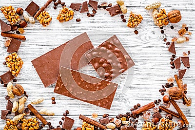 Chocolate bars of different varietes on grey wooden background top view Stock Photo