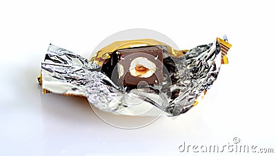 Chocolate bonbon unwrapped in paper Stock Photo