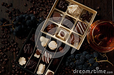 Chocolate box of pralines, gift sweet box, wine for a romantic l Stock Photo