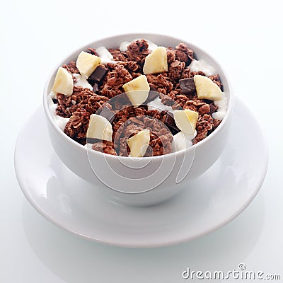 Chocolate breakfast cereal with diced fresh banana Stock Photo