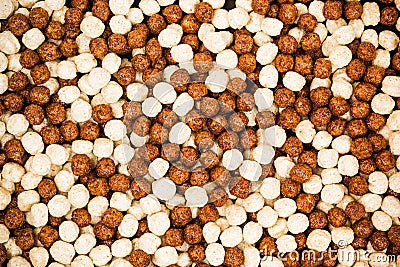 Chocolate breakfast cereal texture. Cereal balls as background. Stock Photo