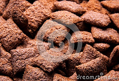 Chocolate breakfast cereal texture. Cereal balls as background. Chocolate corn balls wallpaper background cover Stock Photo