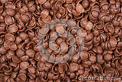 Chocolate breakfast cereals closeup, food background, top view Stock Photo