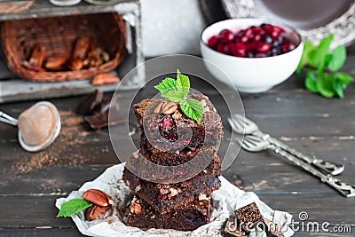 Chocolate brownie with berries and nuts Stock Photo