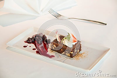 Chocolate brownie cake with strawberry and bluberry filling Stock Photo
