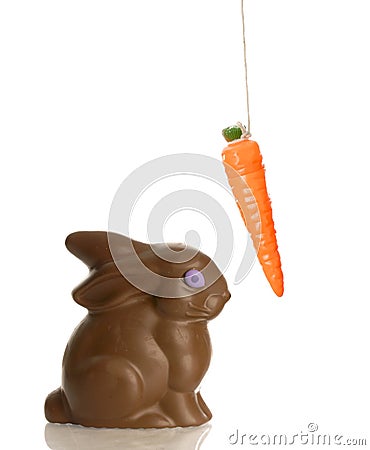 Chocolate bunny with carrot on string Stock Photo