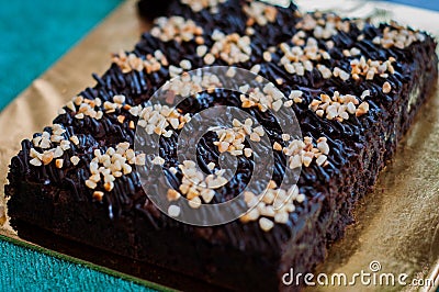 Chocolate Cake Brownie Squares Drizzled With Chocolate Nutella and Walnuts. Stock Photo