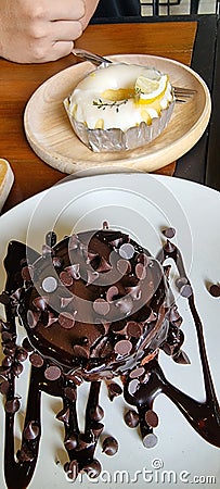 Chocolate cake and lemon tart. Stock Photo