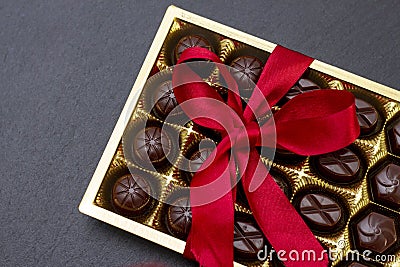 chocolate candies in a box with a red bow Stock Photo