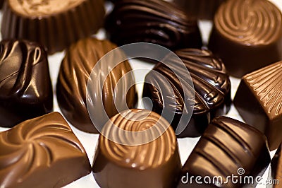 Chocolate candy of various shapes with different fillings. Stock Photo