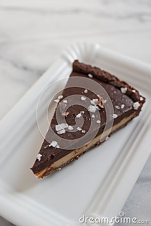 Chocolate caramell tarte with fleur de sal Stock Photo